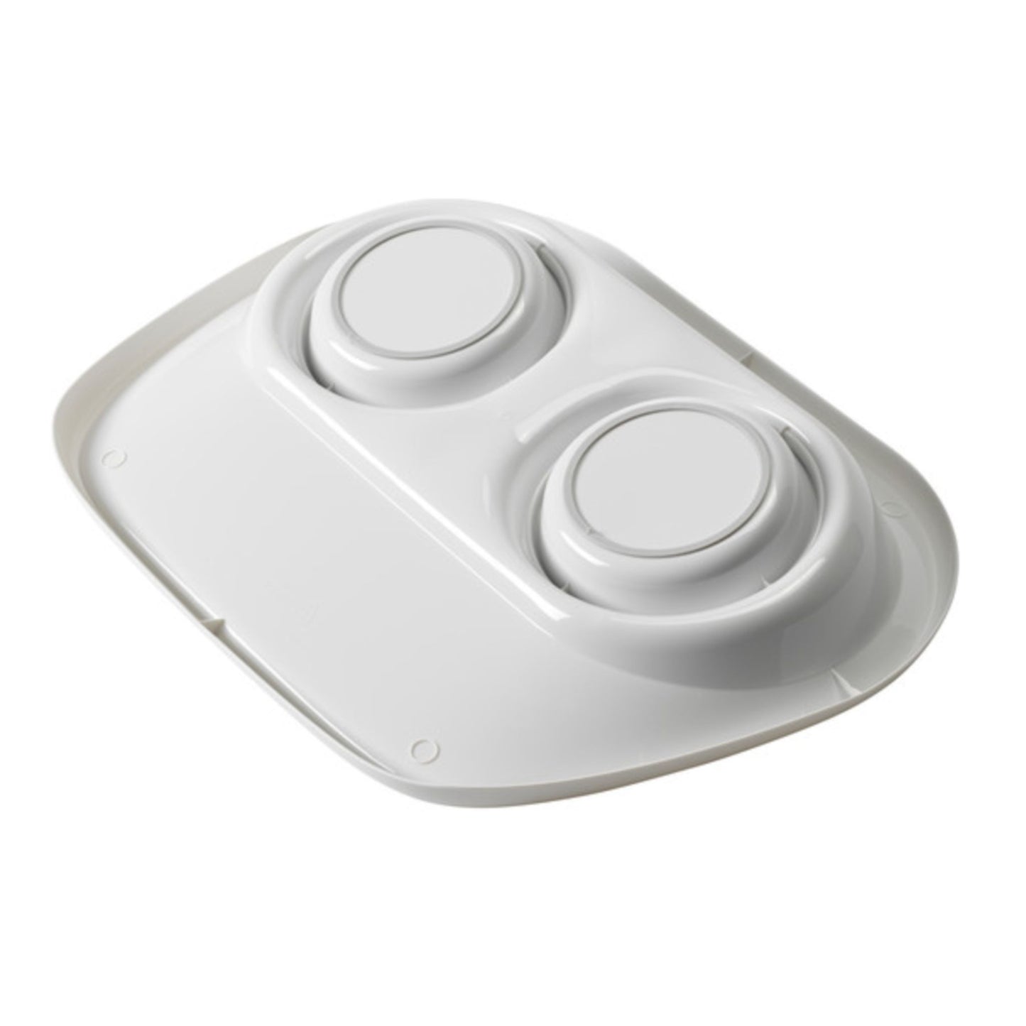 White electronic device with two circular buttons on a white background