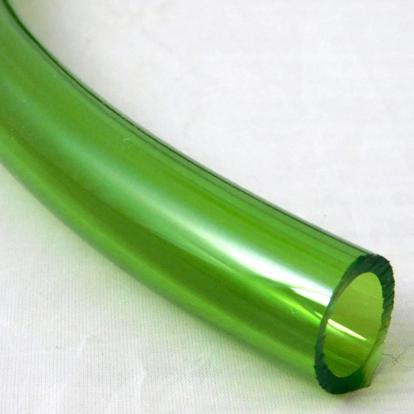Green transparent tube on a white background