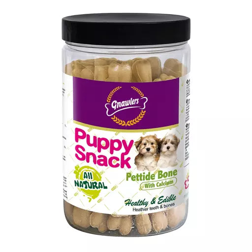 A jar of Gnavlers Puppy Snack Pettide Bone treats for dogs, featuring a black lid and a white and purple label with puppy illustrations, set against a plain white background.