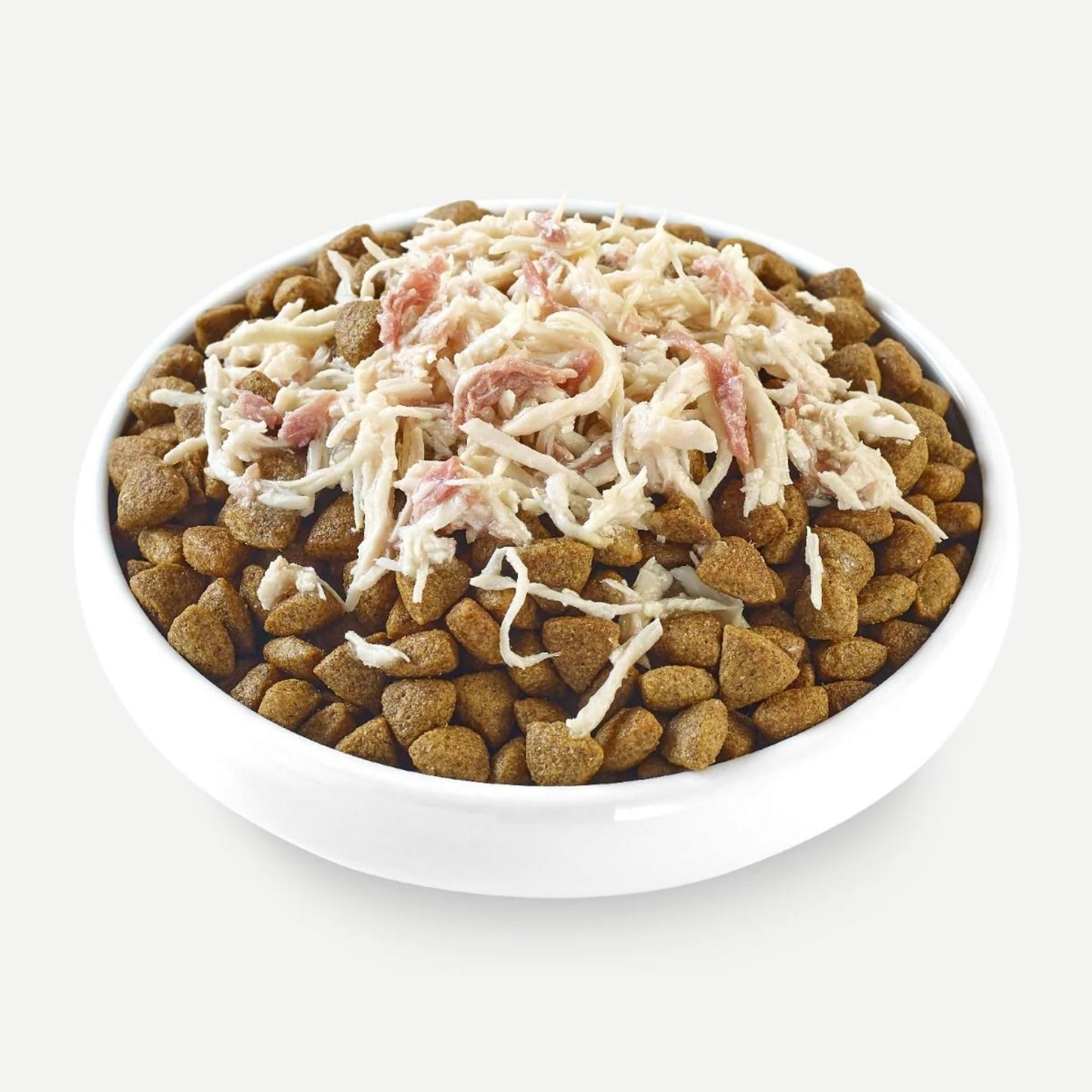 White bowl with pet food and shredded cheese on a white background