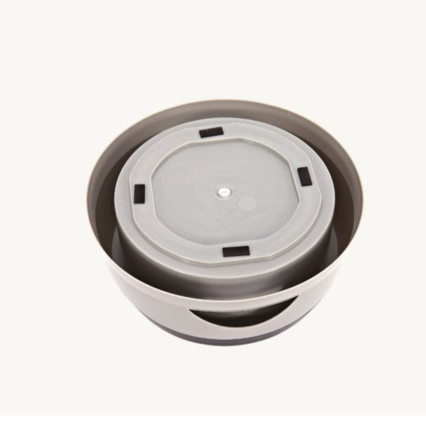 Stack of grey and white disposable coffee cups on a white background