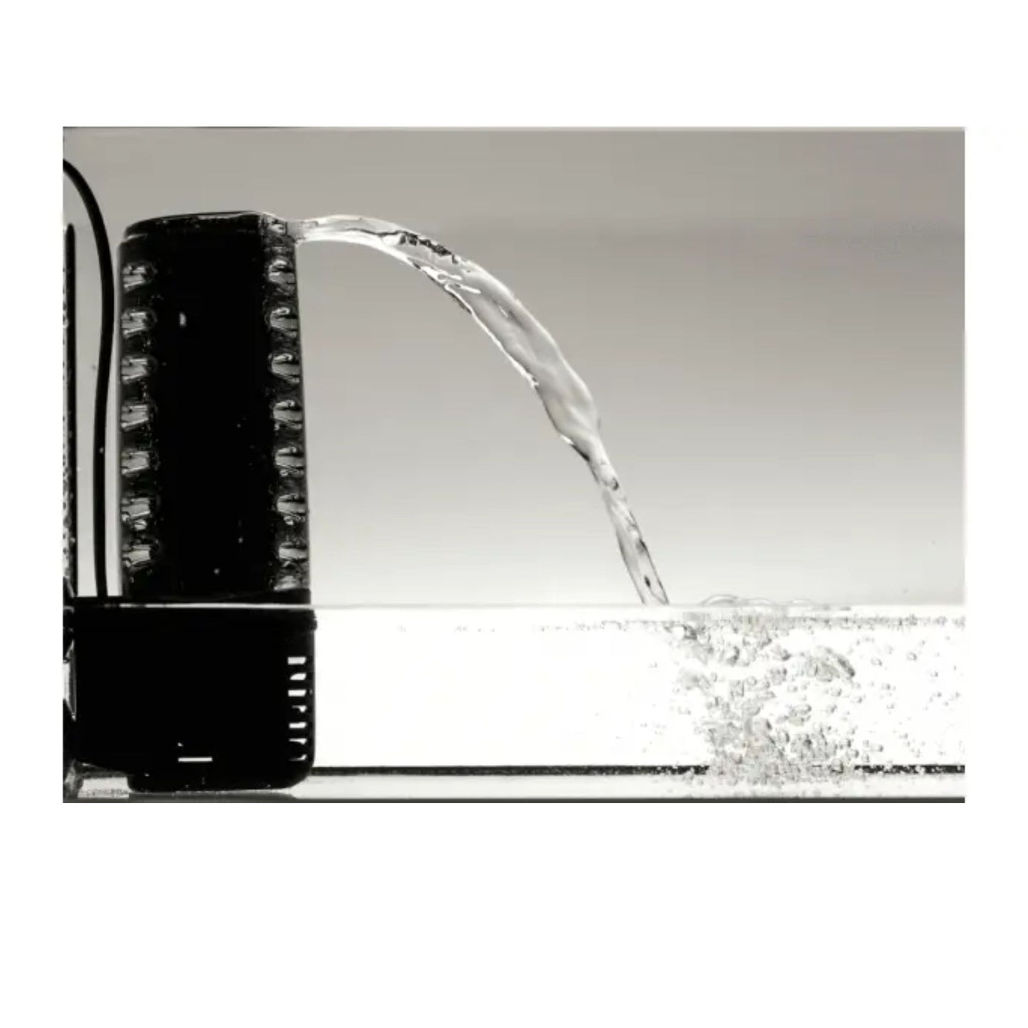 Black water faucet with water flowing onto a white background