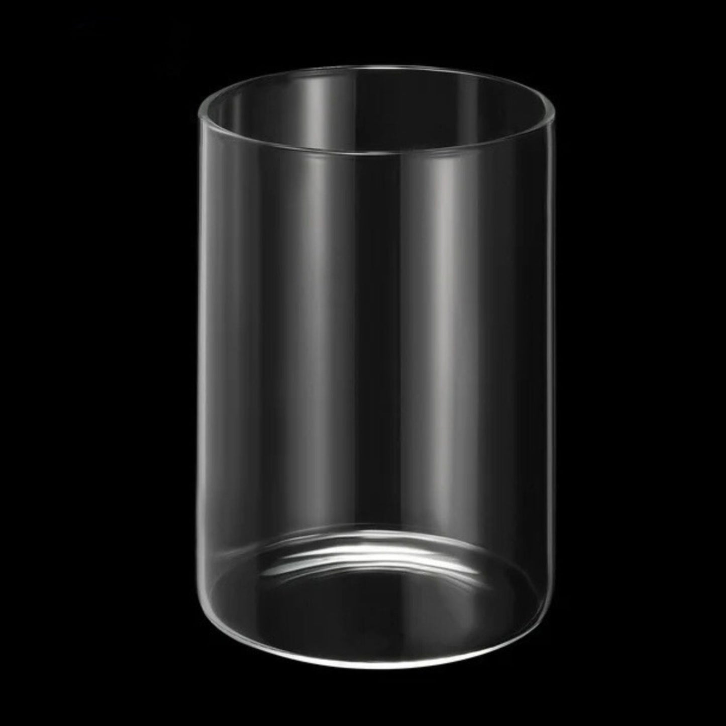 Clear cylindrical vase on a black background